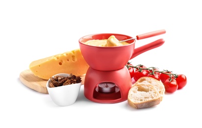 Composition with pot of delicious cheese fondue on white background