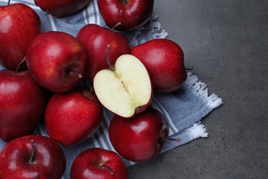 Photo of Fresh ripe red apples on grey table, flat lay