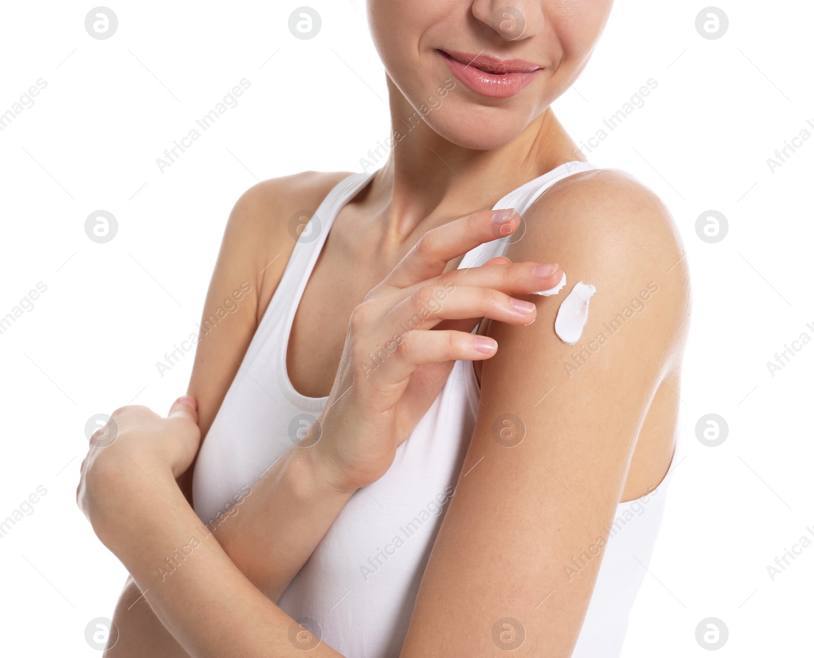 Photo of Young woman applying body cream on white background