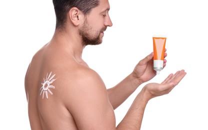 Photo of Handsome man with tube of sun protection cream on white background