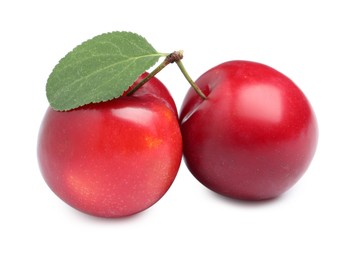 Photo of Delicious ripe cherry plums with leaf on white background