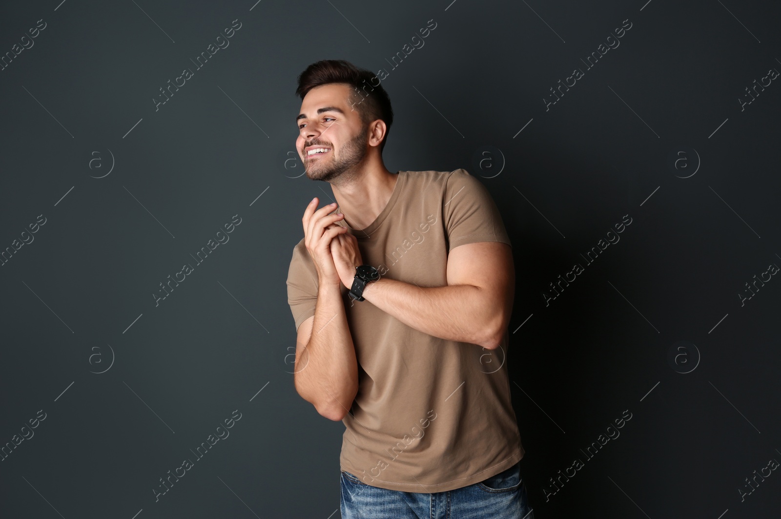 Photo of Portrait of handsome man on dark background