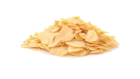 Pile of dried garlic flakes on white background