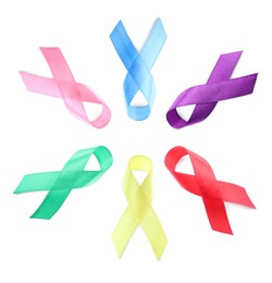 Image of Collection of different color ribbons on white background, top view. World Cancer Day