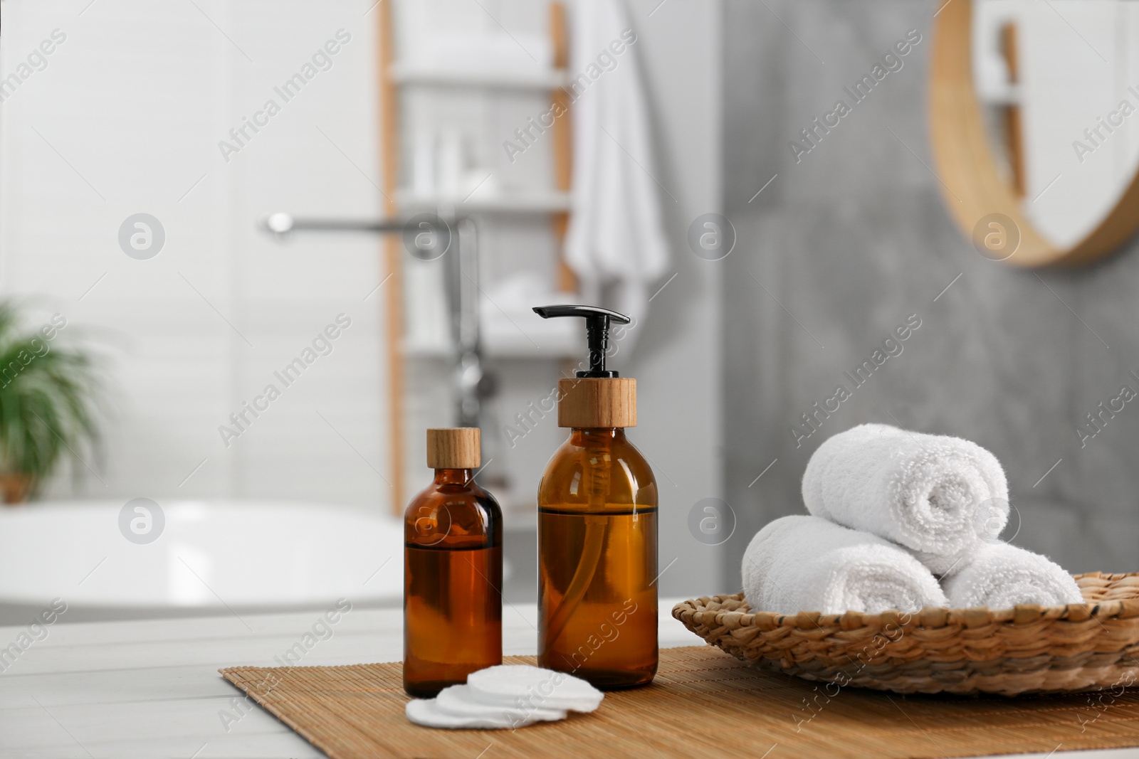 Photo of Composition with spa products on white wooden table in bathroom