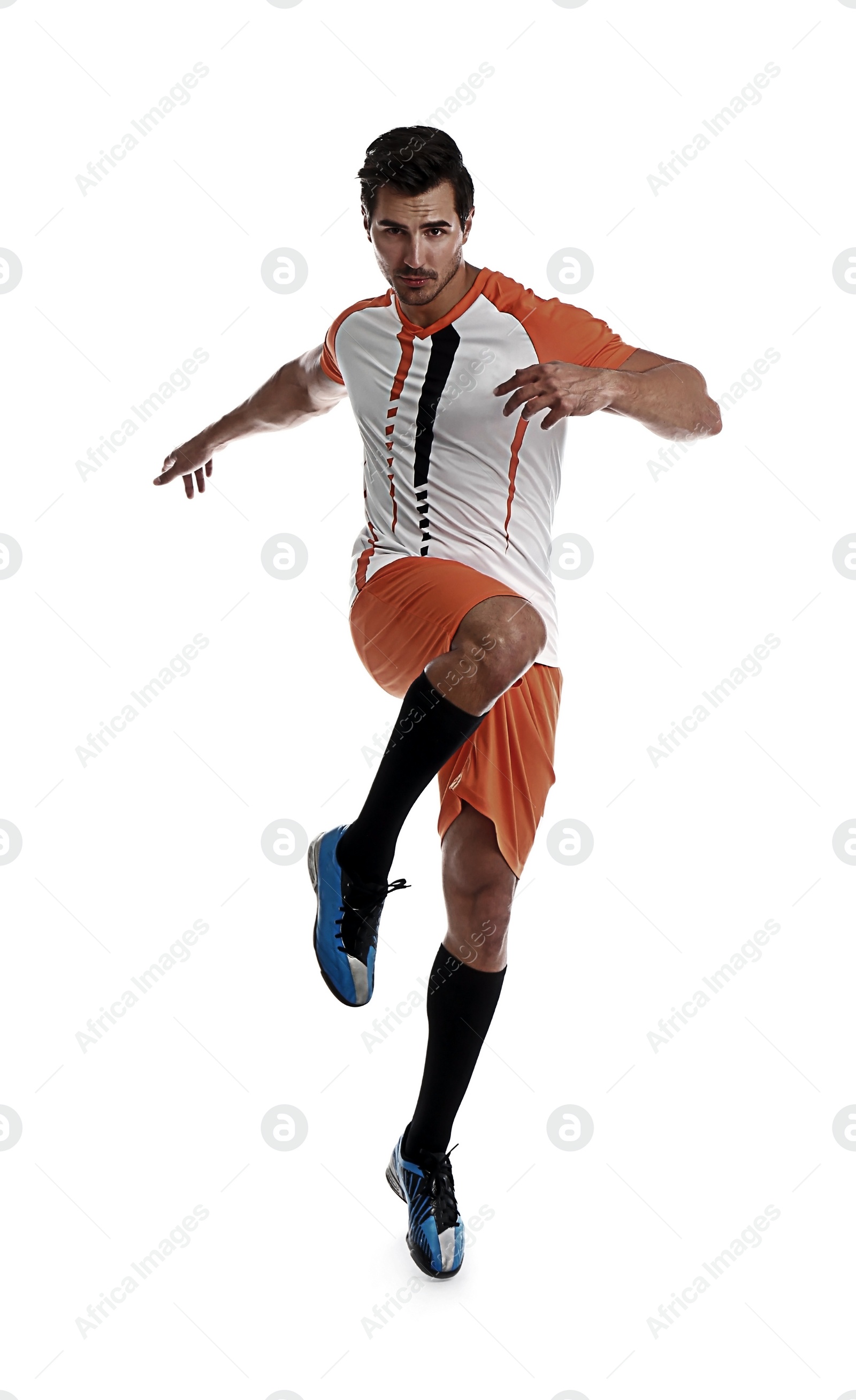 Image of Young man playing football on white background