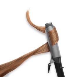 Photo of Curling iron with hair lock on white background, top view