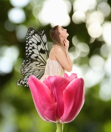 Flower fairy. Beautiful woman with butterfly wings in pink tulip