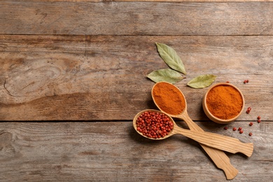 Photo of Flat lay composition with red pepper and space for text on wooden background