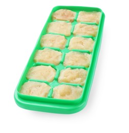 Photo of Puree in ice cube tray on white background. Ready for freezing