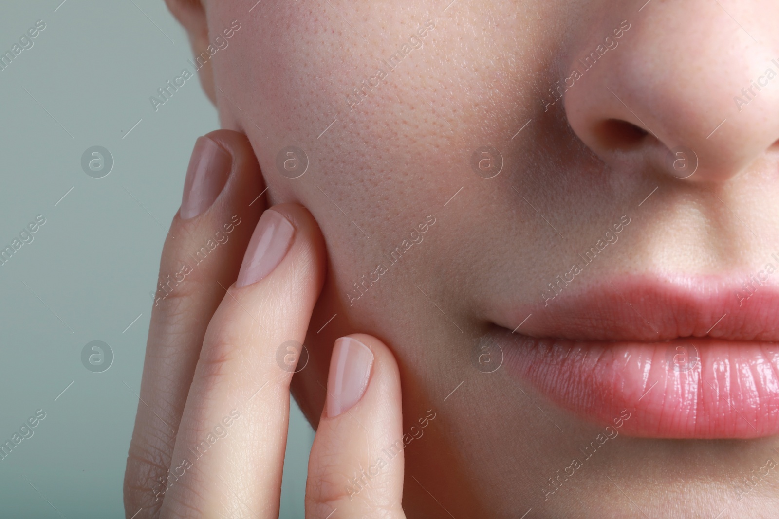 Photo of Closeup view of woman with healthy skin on light grey background