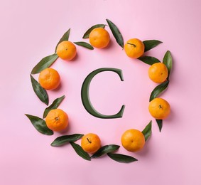 Image of Source of Vitamin C. Fresh ripe tangerines on pink background, flat lay