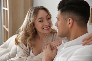 Photo of Lovely couple enjoying time together at home