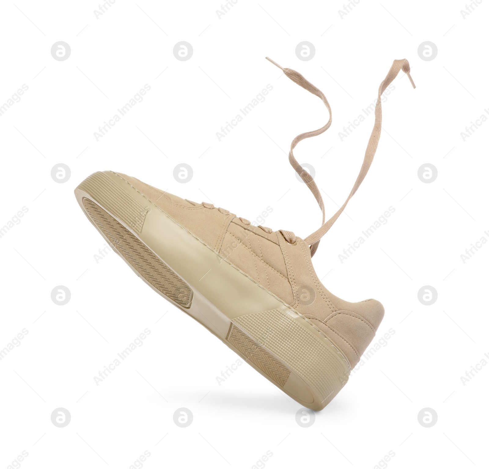 Photo of One stylish beige sneaker isolated on white