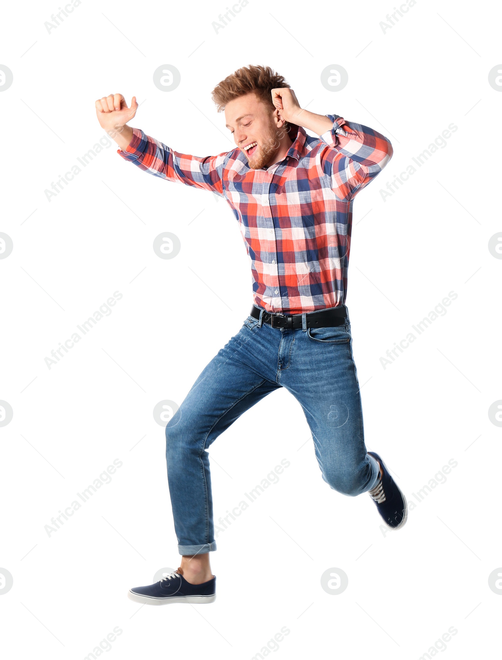 Photo of Full length portrait of happy handsome man jumping on white background