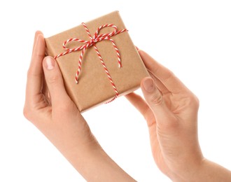 Photo of Woman holding parcel wrapped in kraft paper on white background, closeup