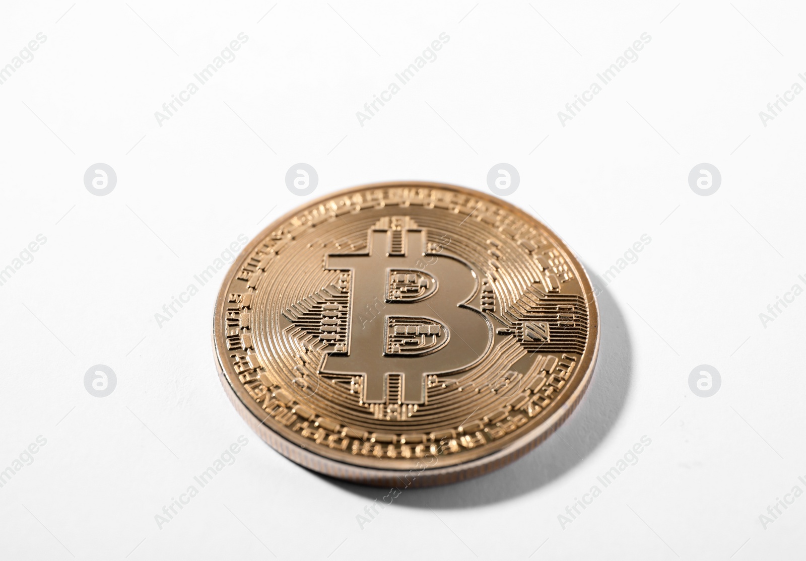 Photo of Golden bitcoin on white background. Digital currency