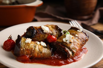 Tasty eggplant rolls served on table, closeup