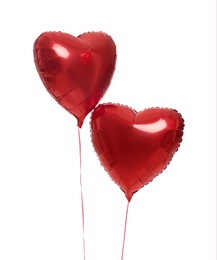 Photo of Beautiful red heart shaped balloons isolated on white. Valentine's day celebration