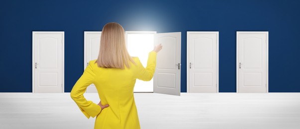 Image of Woman standing in front of many doors, back view. Banner design