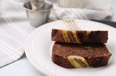 Slices of delicious banana bread served on table, closeup. Space for text