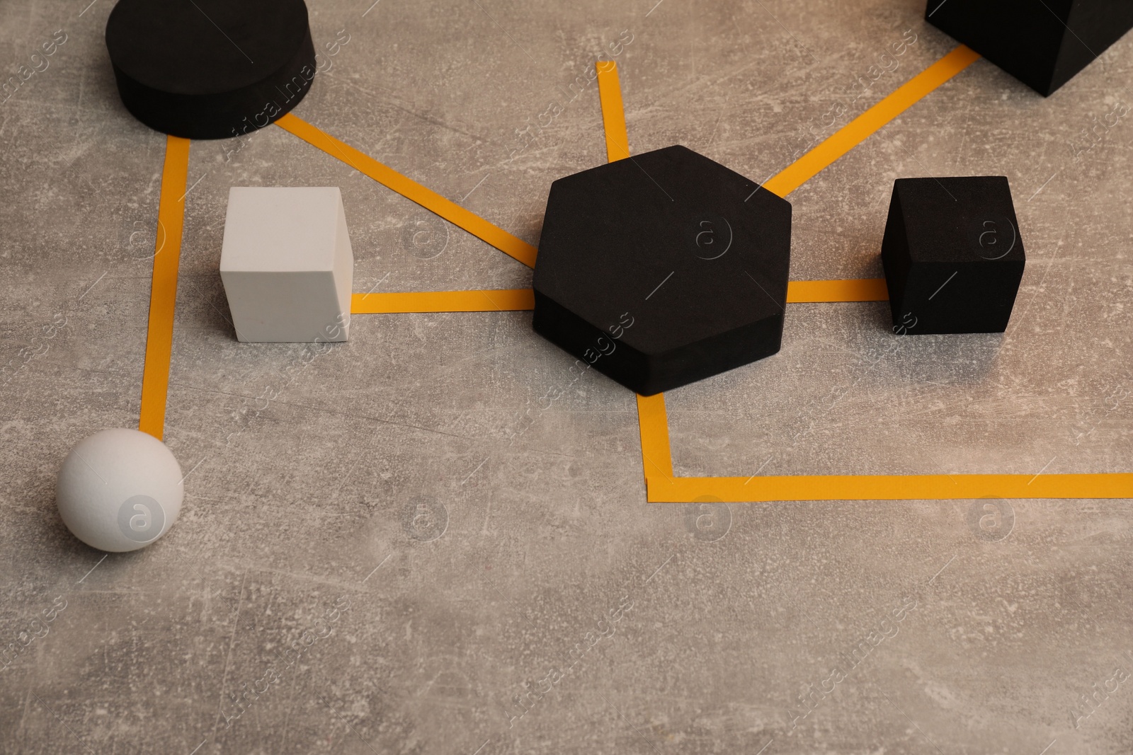 Photo of Business process organization and optimization. Scheme with geometric figures on grey table