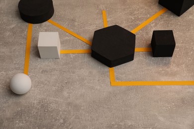 Photo of Business process organization and optimization. Scheme with geometric figures on grey table