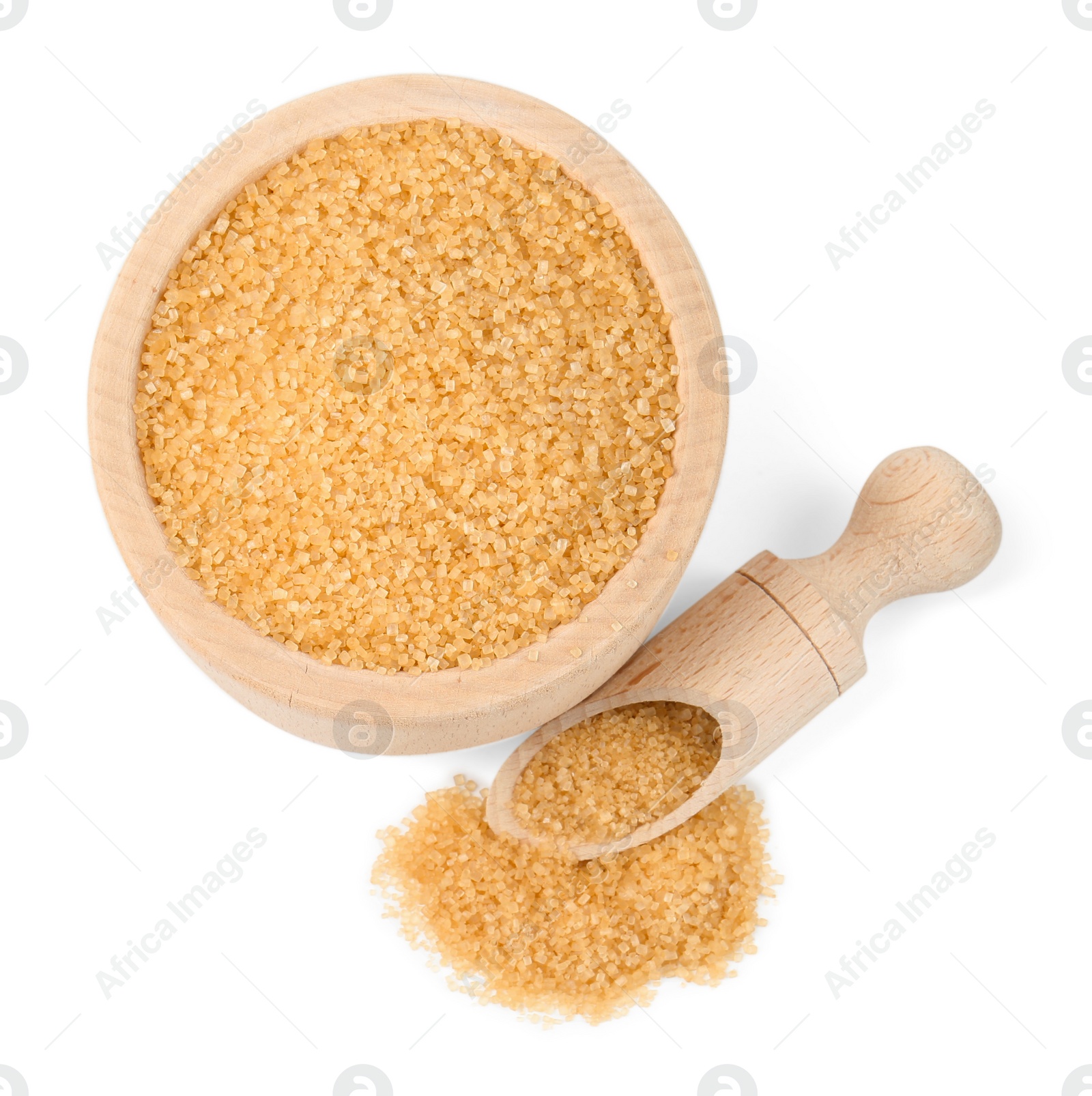 Photo of Brown sugar in bowl and scoop isolated on white, top view