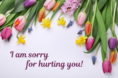 Image of Apology card design with flowers and text I Am Sorry For Hurting You! on white background, flat lay