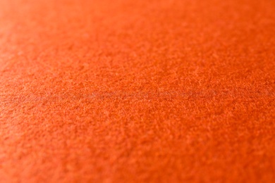 Photo of Orange textured surface as background, closeup view