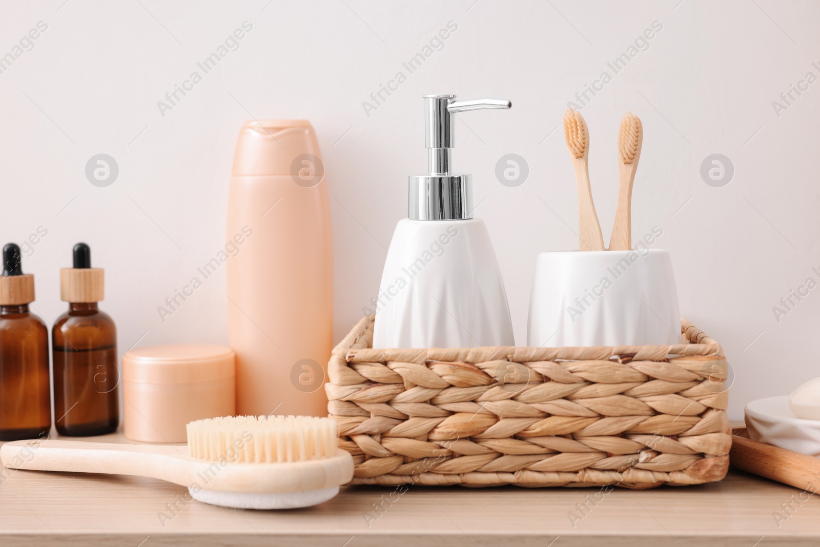 Photo of Different bath accessories and personal care products on wooden table