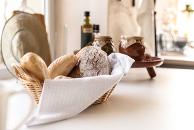 Baked goods on white table in stylish kitchen