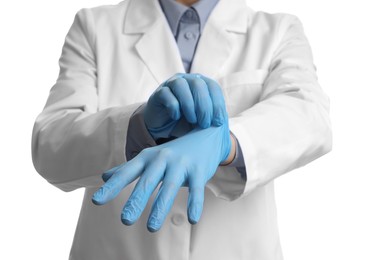 Photo of Doctor wearing light blue medical gloves on white background, closeup