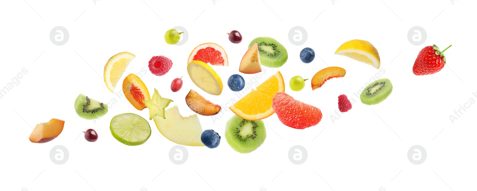 Image of Set of different cut fresh fruits and berries falling on white background. Banner design