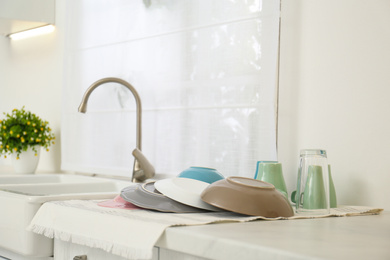 Clean dishes drying on counter in kitchen