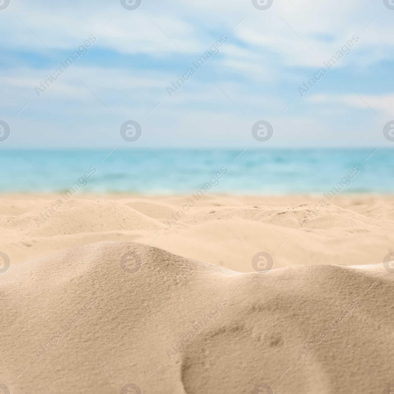 Image of Beautiful beach with golden sand near ocean, closeup view