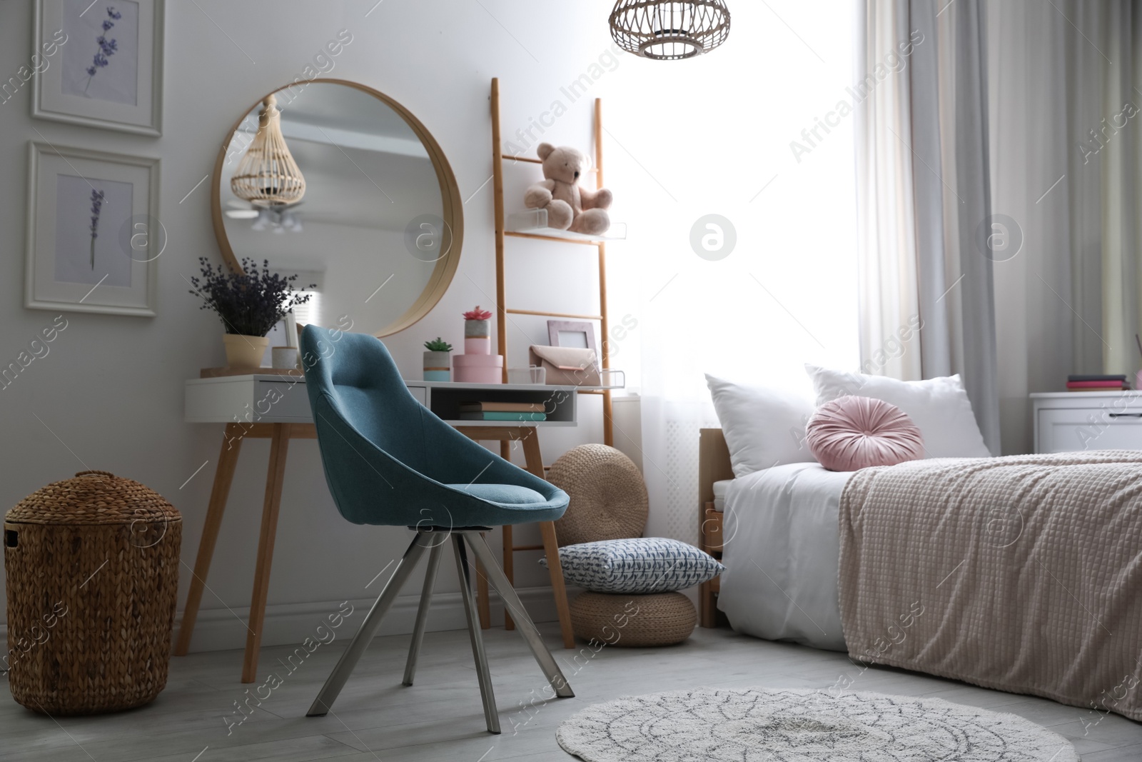 Photo of Teenage girl's bedroom interior with stylish furniture. Idea for design