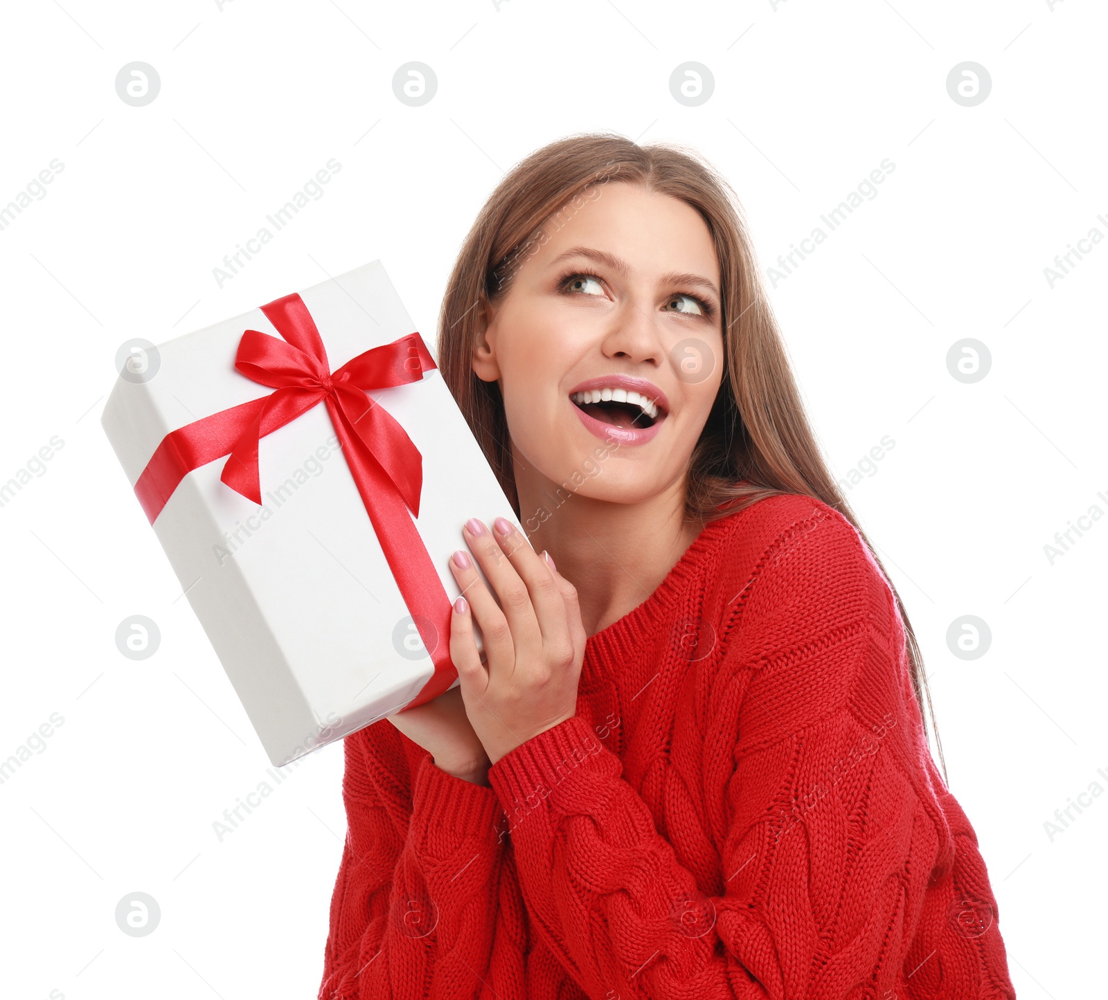 Photo of Emotional young woman with Christmas gift on white background