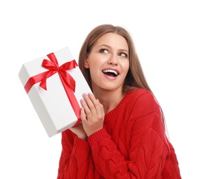 Photo of Emotional young woman with Christmas gift on white background