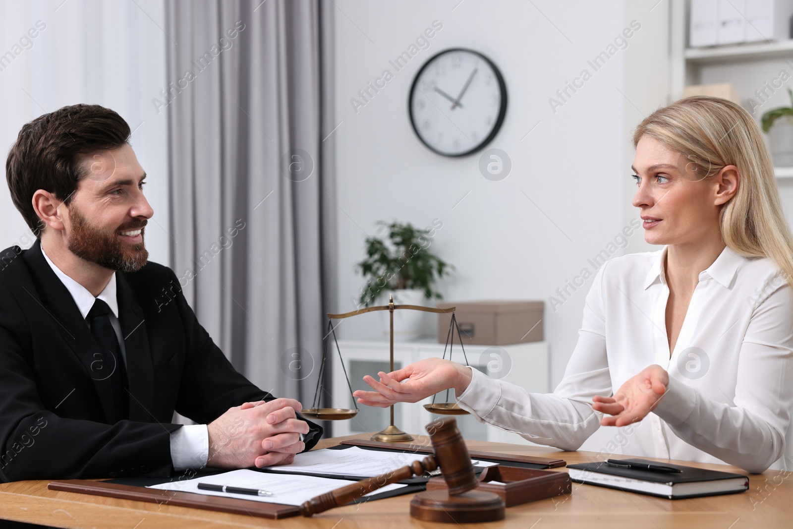 Photo of Woman having meeting with lawyer in office