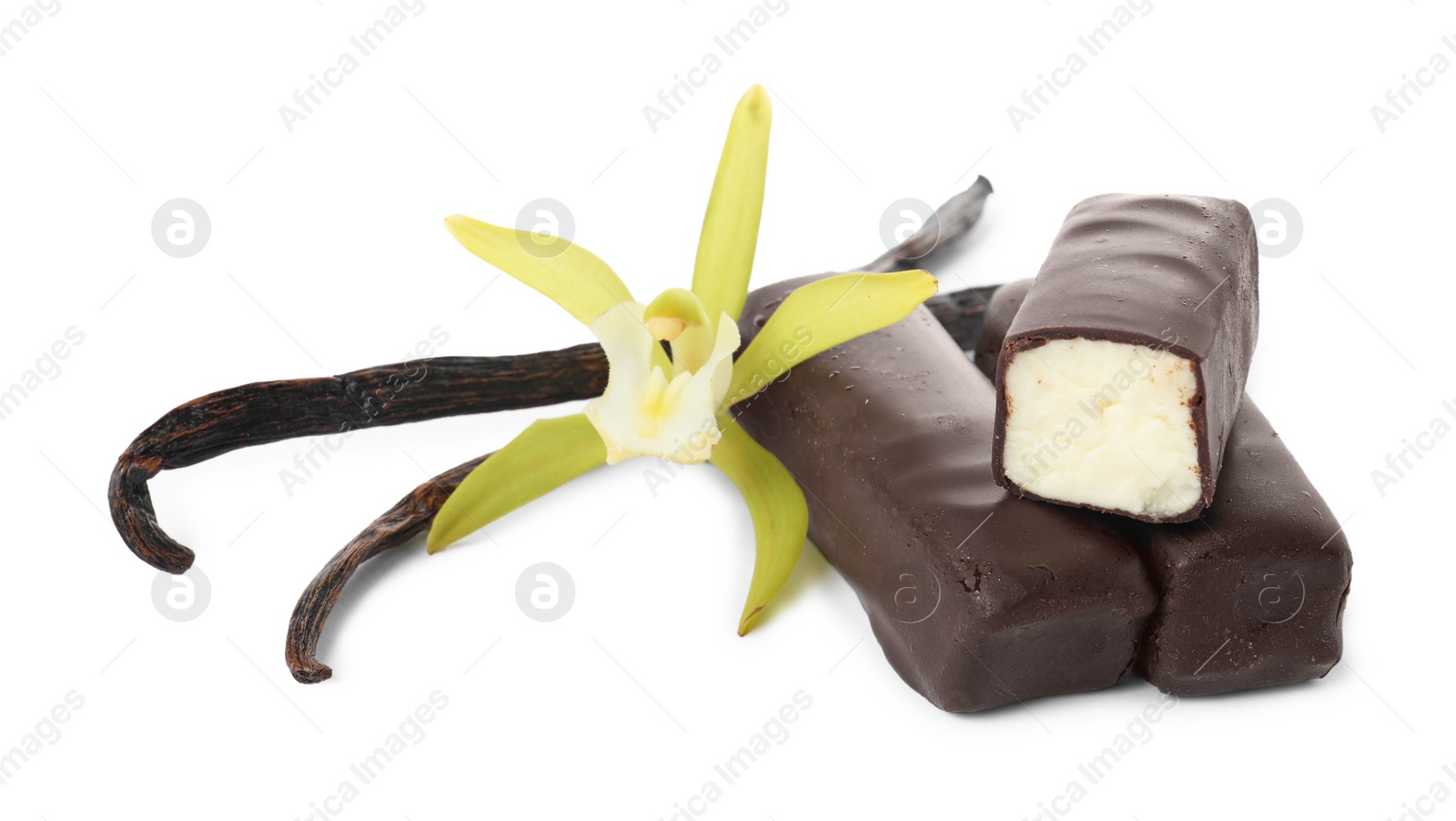 Photo of Glazed curd cheese bars, vanilla pods and flower isolated on white