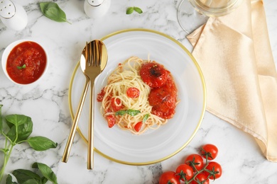 Photo of Flat lay composition with tasty pasta on white marble table