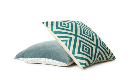 Different colorful decorative pillows on white background