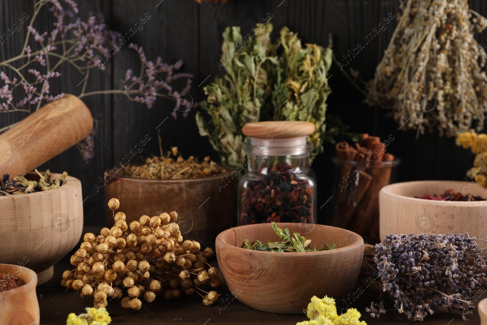 Photo of Many different dry herbs and flowers on table