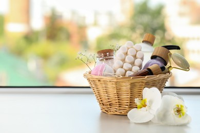 Photo of Spa gift set with different products on window sill. Space for text