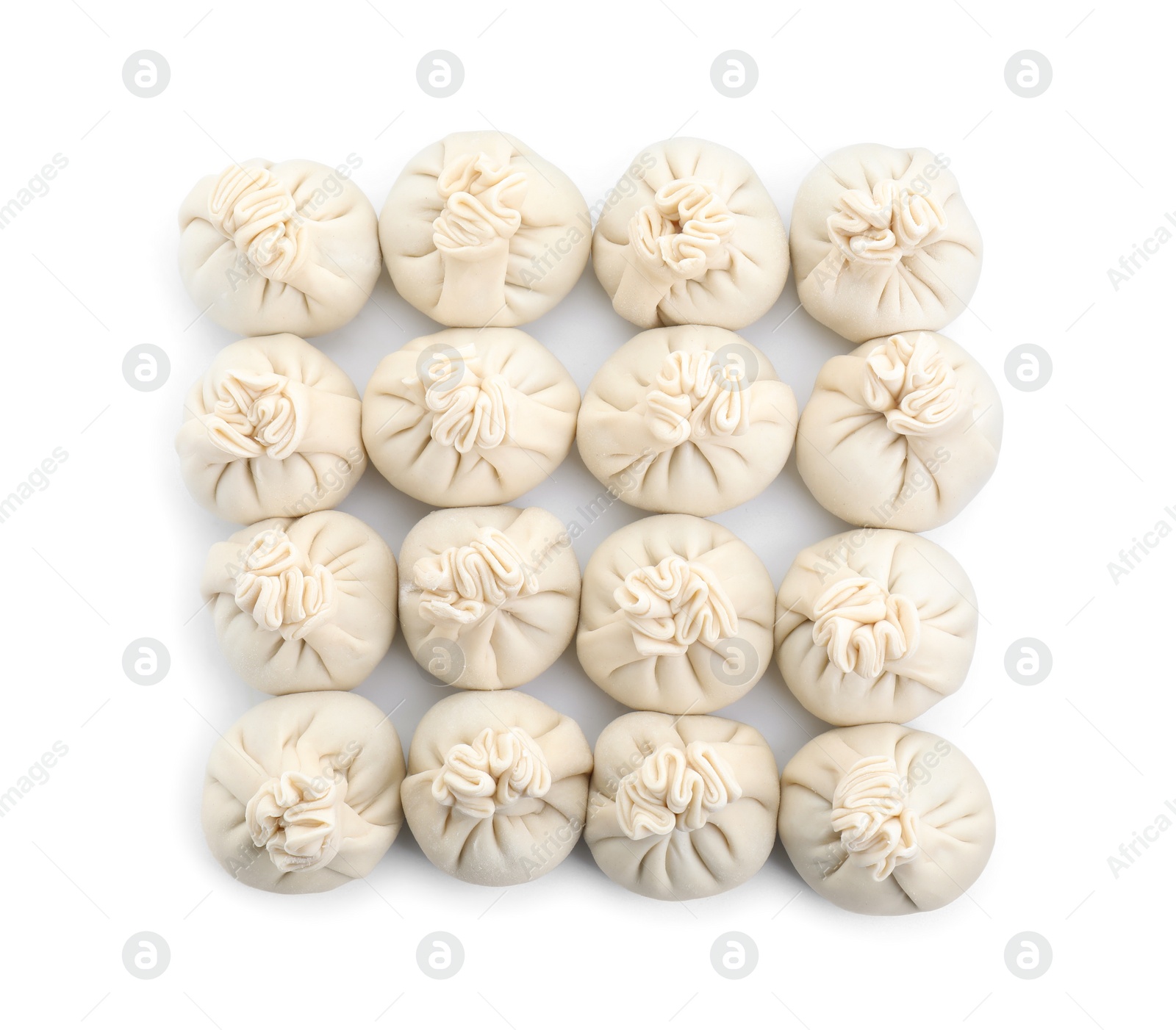 Photo of Uncooked khinkali (dumplings) isolated on white, top view. Georgian cuisine