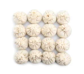 Photo of Uncooked khinkali (dumplings) isolated on white, top view. Georgian cuisine