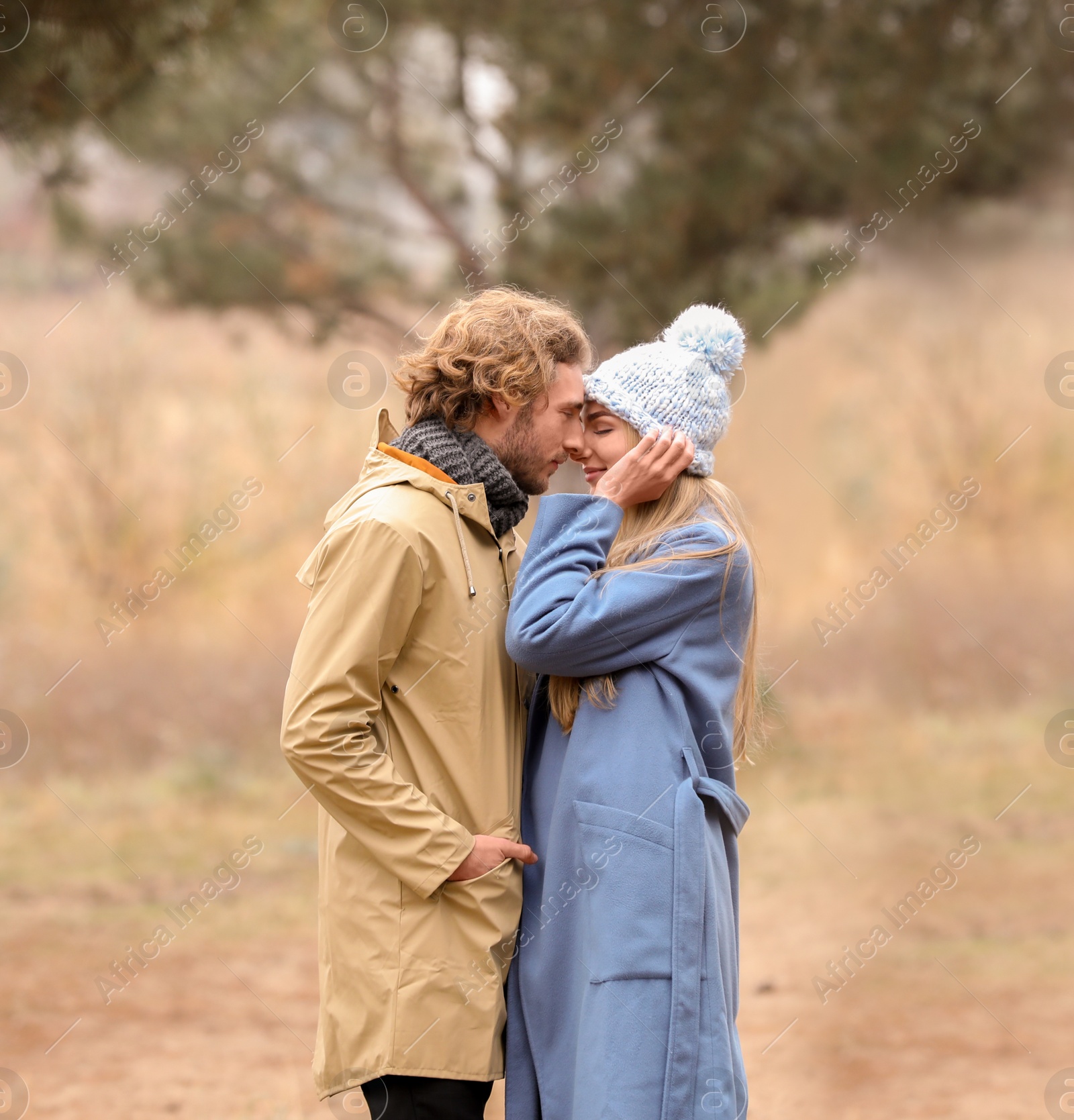 Photo of Young romantic couple in park on autumn day