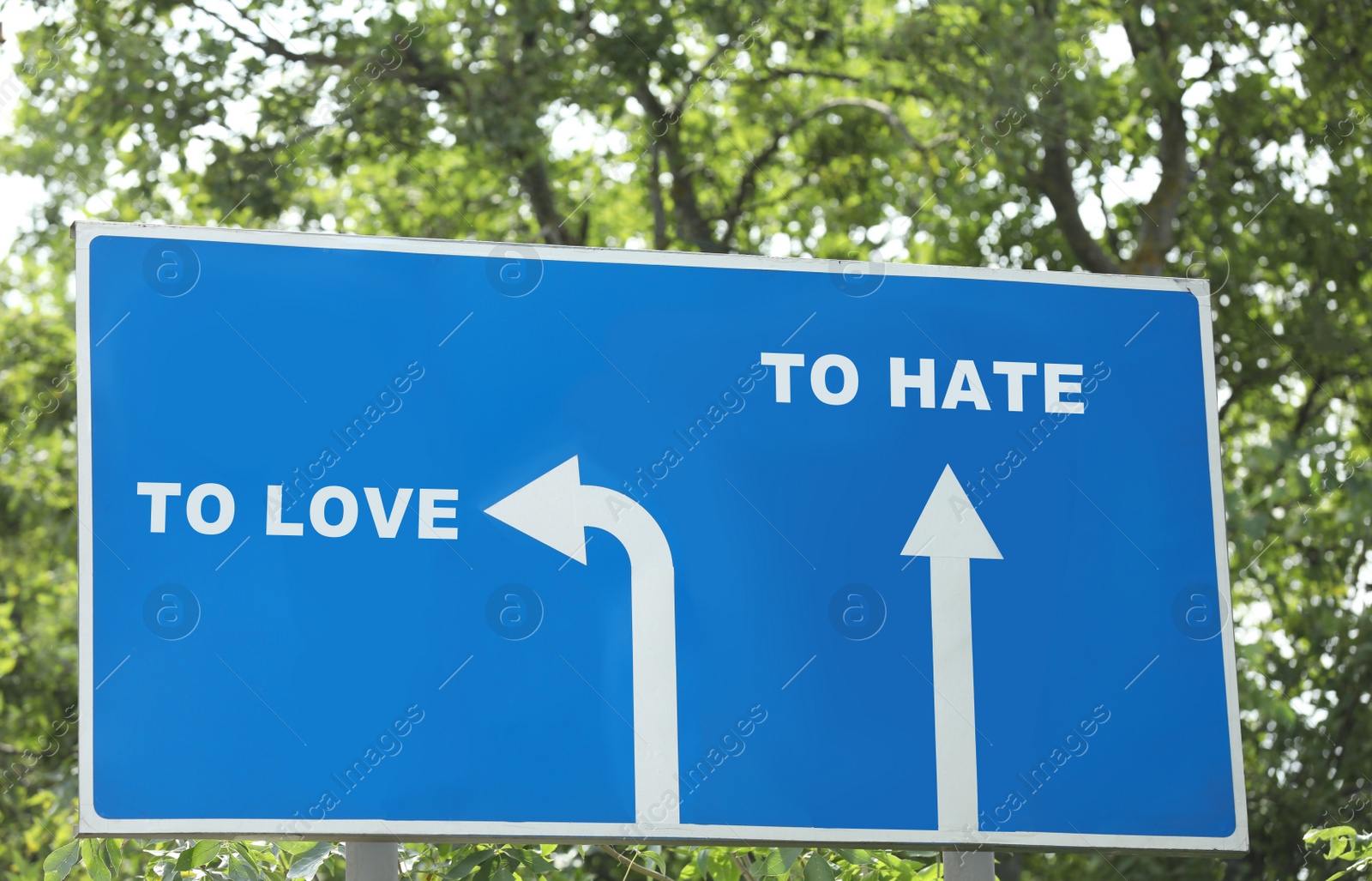 Image of Road sign with different directions - TO HATE or TO LOVE outdoors