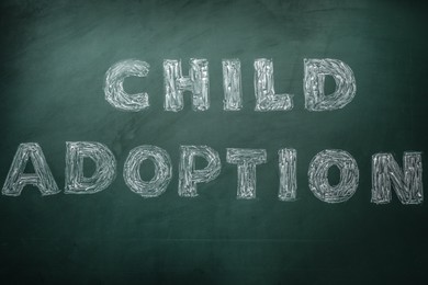 Photo of Phrase Child Adoption written with chalk on board